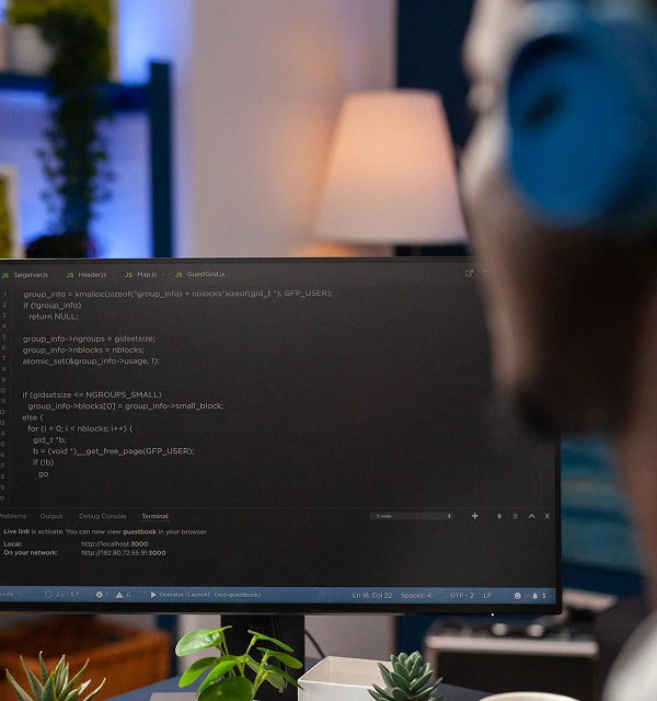 Person coding at desk